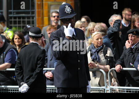 Southwark, London, UK. 10th Apr, 2017. Thousand of people and police officers in No.1 Dress uniform line the streets around Southwark Cathedral in London where the funeral of PC Keith Palmer takes place. PC Palmer was murdered just inside the gate by Westminster attacker Khalid Masood - an attack in which he also killed four people on Westminster Bridge Credit: Dinendra Haria/Alamy Live News Stock Photo