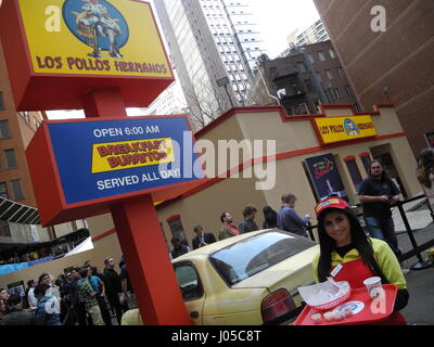 New York, US. 10th Apr, 2017. An employee stands in front of the fictious fast food restaurant 'Los Pollos Hermanos' in New York, US, 10 April 2017. After Austin (Texas) and Los Angeles, another branch of the fictious chain opened on Sunday and Monday in Manhattan. The temporary fast food restaurant designed after the TV show 'Breaking Bad' was created from a container on a parking lot. Photo: Johannes Schmitt-Tegge/dpa/Alamy Live News Stock Photo
