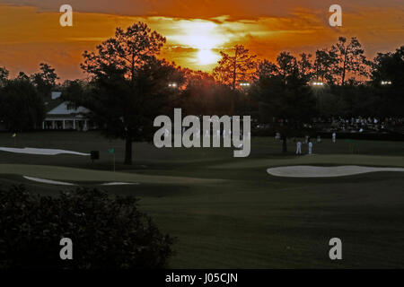 April 3rd 2017, Augusta, Georgia, USA;  Golfers warm up on the practice range as the sun rises on the first day of practice for the 2017 Masters Tournament on April 3, 2017, at Augusta National Golf Club in Augusta, GA. Stock Photo