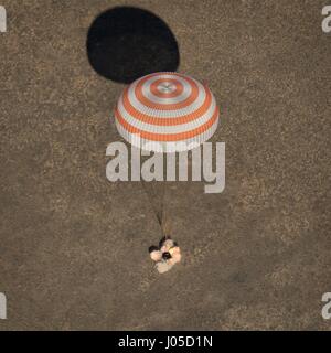 Zhezkazgan, Kazakhstan. 10th Apr, 2017.  The Russian Soyuz MS-02 spacecraft touches down in a remote area April 10, 2017 near Zhezkazgan, Kazakhstan. The rocket is carrying the International Space Station Expedition 50 mission crew astronaut Shane Kimbrough of NASA and cosmonauts Sergey Ryzhikov and Andrey Borisenko of Roscosmos after 173 days in space. Credit: Planetpix/Alamy Live News Stock Photo