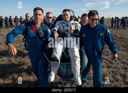 Zhezkazgan, Kazakhstan. 10th Apr, 2017.  NASA astronaut Shane Kimbrough is carried to the medical tent shortly after landing in the Soyuz MS-02 spacecraft April 10, 2017 near Zhezkazgan, Kazakhstan. The spacecraft returned carrying the International Space Station Expedition 50 mission crew Kimbrough and cosmonauts Sergey Ryzhikov and Andrey Borisenko of Roscosmos after 173 days in space. Credit: Planetpix/Alamy Live News Stock Photo