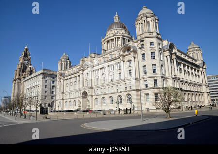 The 'Three Graces' on Pier Head area on the River Mersey in Liverpool - the Liver, Cunard and Port of Liverpool Buildings Stock Photo