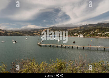 View across the harbour area of Akaroa, Canterbury region, South Island, New Zealand. Stock Photo