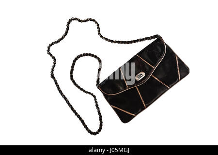 Female clutch bag on a long handle-chain, isolated on a white background. Stock Photo
