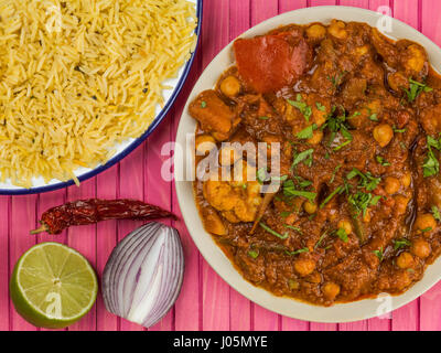 Mixed Indian Vegetable Masala Curry Against a Pink Background Stock Photo