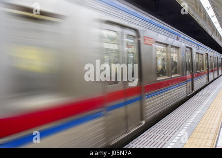 Subway train going through the station Stock Photo