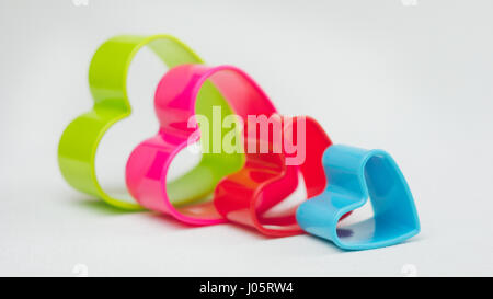 Heart shaped cookie cutter on white background Stock Photo