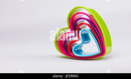 Heart shaped cookie cutter on white background Stock Photo