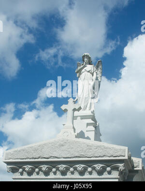 Statue on top of a mausoleum, in a cemetery, New Orleans, Louisiana. Stock Photo