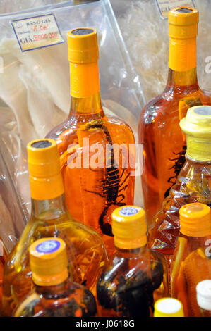 HO CHI MINH, VIETNAM - FEBRUARY 15, 2013: Brandy from Laos with a scorpion inside as souvenirs for selling in the streets of Saigon, Vietnam Stock Photo