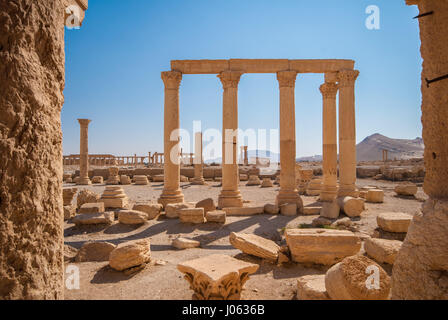 Palmyra. A THOUGHT-PROVOKING series of images by a British photographer have been released showing what Syria was like just before its six-year civil war broke out. The stunning collection of photographs shows Aleppo’s citadel which is now is ruins, the destroyed Roman Theatre and ancient tetrapylon historical ruins of Palmyra and the stunning UNESCO world heritage site of the Umayyad mosque, Aleppo which was built between the 8th and 13th centuries. Other pictures show a couple of carefree boys having a water fight in the street, people relaxing in Aleppo’s juice bars and traffic in Homs goin Stock Photo