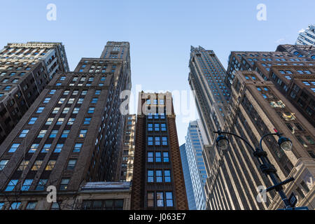 Sky scrapers of various ages within a New York street. Stock Photo