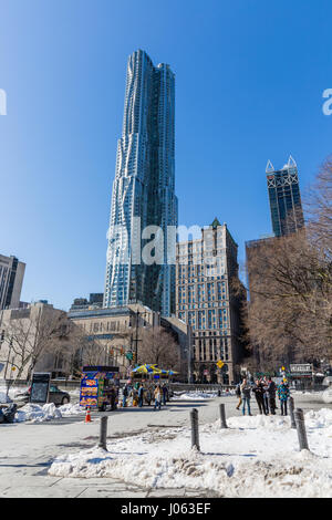 Designed by Frank Gehry, 8 Spruce Street is one of the tallest residential towers in the world and dwarfs more conventional apartment blocks Stock Photo