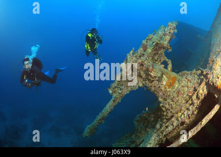 Guns on the wrecked ship. EERIE underwater pictures show inside the wreckage of the sunken British World War Two ship SS Thistlegorm on the seventy-fifth anniversary of her sinking. The series of images show the rusted remains of the merchant navy ship’s cargo which includes motorbikes, army trucks and an aircraft propeller. Other pictures show how sea life have been inhabiting the wreckage. Stock Photo