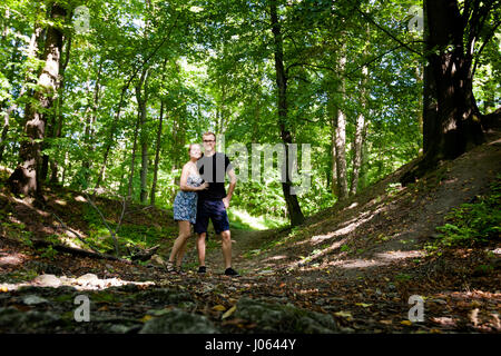 Young tourists couple in Beautiful Koprivnice forest, near old ruins of Sostyn castle. Beautiful Czech landscape Stock Photo