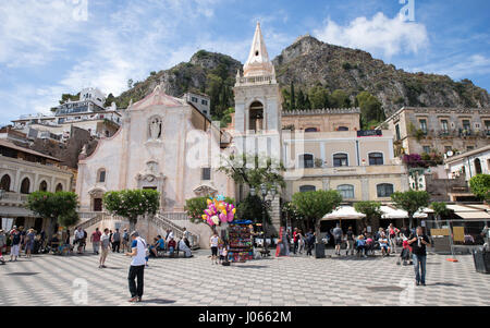 Tourists at the square in Taormina, which is a small town in Sicily, Italy. Stock Photo
