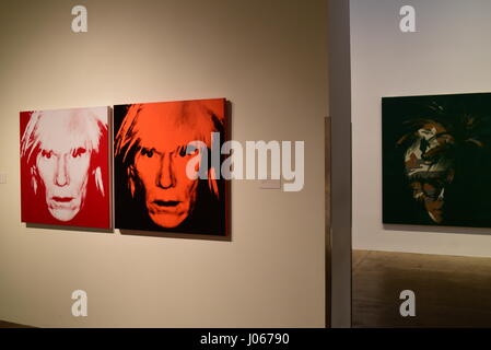 Visitors in front of Andy Warhol's Shot Orange Marilyn (1964) in