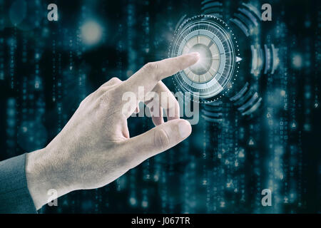 Cropped hand of businessman touching digital screen against digital composite of volume knob with graphs Stock Photo