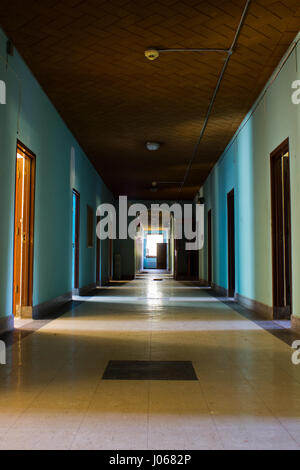 CONNECTICUT, USA: HAUNTING images from inside one of America’s top spots for ghost-hunters who claim to see a young glowing girl dressed in white staring out of the windows of this abandoned asylum. The psychiatric hospital appeared under a false name on MTV’s hit show Fear which saw contestants spend a weekend at various haunted locations around the country. These eerie photographs were taken by urban explorer Drew Thomas Scavello (27) at the Fairfield Hills State Hospital in Newtown, Connecticut. Drew Thomas Scavello / mediadrumworld.com Stock Photo