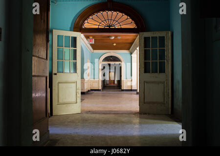 CONNECTICUT, USA: HAUNTING images from inside one of America’s top spots for ghost-hunters who claim to see a young glowing girl dressed in white staring out of the windows of this abandoned asylum. The psychiatric hospital appeared under a false name on MTV’s hit show Fear which saw contestants spend a weekend at various haunted locations around the country. These eerie photographs were taken by urban explorer Drew Thomas Scavello (27) at the Fairfield Hills State Hospital in Newtown, Connecticut. Drew Thomas Scavello / mediadrumworld.com Stock Photo