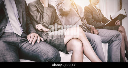 Business people waiting to be called for interview in office Stock Photo