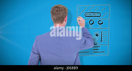 Businessman writing on a white background against blue background Stock Photo