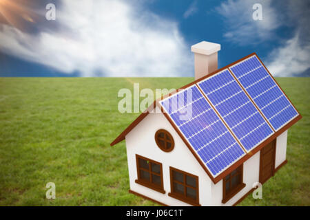 3d image of house with solar panels against blue sky with clouds Stock Photo