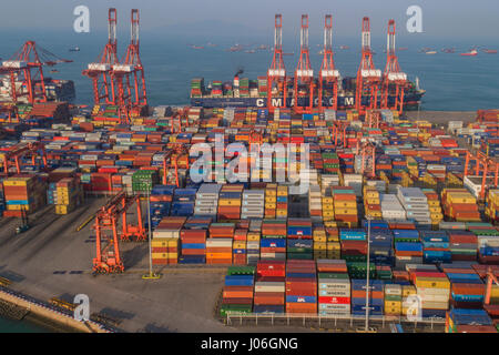A section of Shenzhen port viewed from the air near Shekou, Nanshan. Shenzhen is the second busiest port in China and one of the busiest in the world. Stock Photo