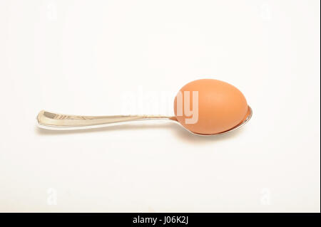 Egg and spoon isolated on white, Stock Photo