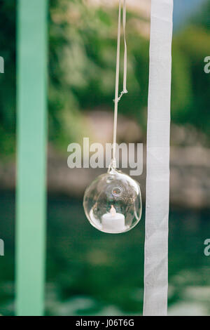 Candles in glass lamps. Wedding decorations. Wedding in Montenegro. Stock Photo