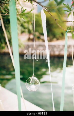 Candles in glass lamps. Wedding decorations. Wedding in Monteneg Stock Photo