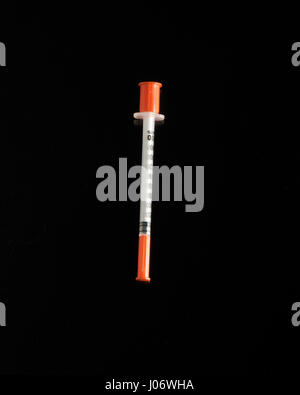 Intravenous needle on black background. Stock Photo