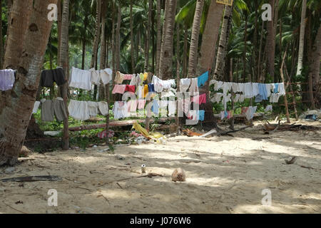 Washing line unter the palms on the beach of El Nido Palawan Stock Photo