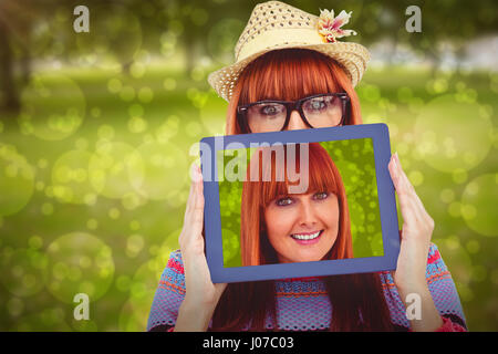 Hiding face behind the hat. Stylish beautiful young girl in bikini stands  and posing in the studio Stock Photo - Alamy