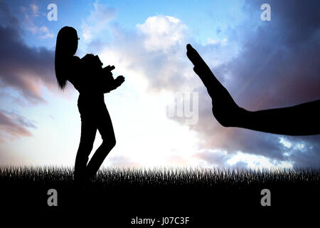 Side view of young woman carrying a pile of books against cloudy sky Stock Photo