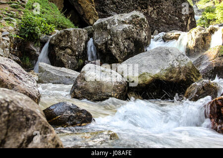 Flowing water in the mountains Stock Photo