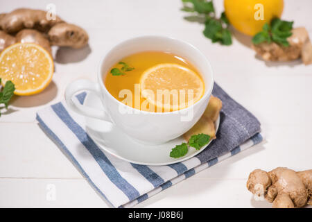 Healthy ginger tea ingredients on a wooden table Stock Photo