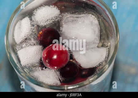frozen berries closeup on wooden background vitamin Stock Photo