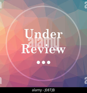 Under review icon. Under review website button on low poly background. Stock Photo