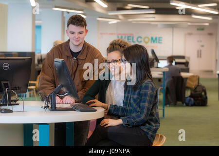 students studying together with computer Stock Photo