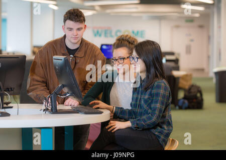 students studying together with computer Stock Photo