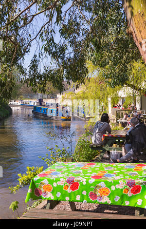 Lock Inn café with views of narrow boats passing along the Kennet and Avon canal at Bradford on Avon, Wiltshire in April on a lovely Spring day Stock Photo
