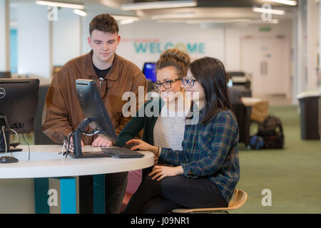 students studying together with computer Stock Photo