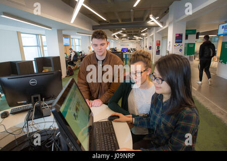 students studying together with computer Stock Photo