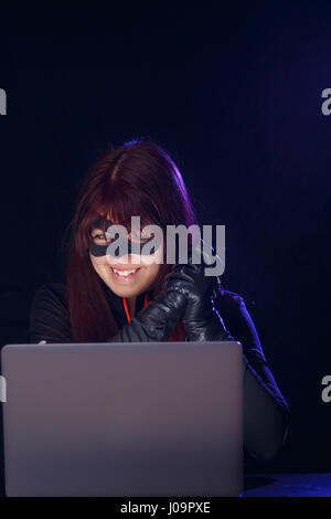 Night hacker girl in mask Stock Photo