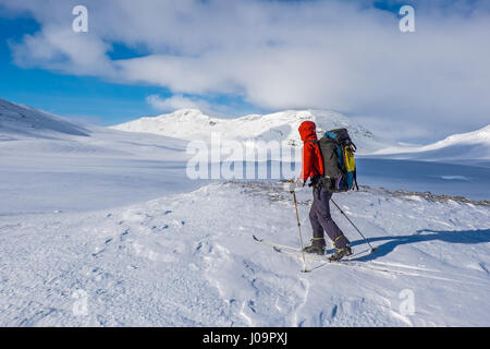 Ski-tourers skiing the Troms Border Trail, a long distance route in mountains of Northern Norway and Sweden Stock Photo