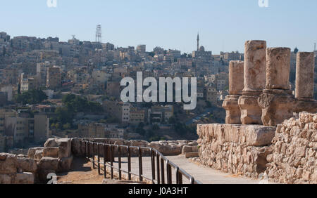 Jordan: the skyline of Amman, seen through the ruins of the Amman Citadel, the archaeological site and one of the original nucleus of the old town Stock Photo