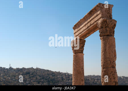 Jordan: the skyline of Amman, seen through the ruins of the Amman Citadel, the archaeological site and one of the original nucleus of the old town Stock Photo