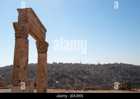 Jordan: the skyline of Amman, seen through the ruins of the Amman Citadel, the archaeological site and one of the original nucleus of the old town Stock Photo