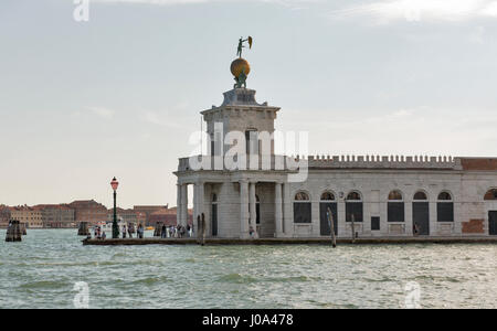 VENICE, ITALY - SEPTEMBER 23, 2016: Unrecognized people visit Punta della Dogane, former Customs House in Dorsoduro district. Venice is one of the wor Stock Photo